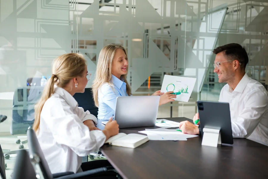 Engaging business meeting in a modern office showcasing collaboration and strategic discussions among team members
